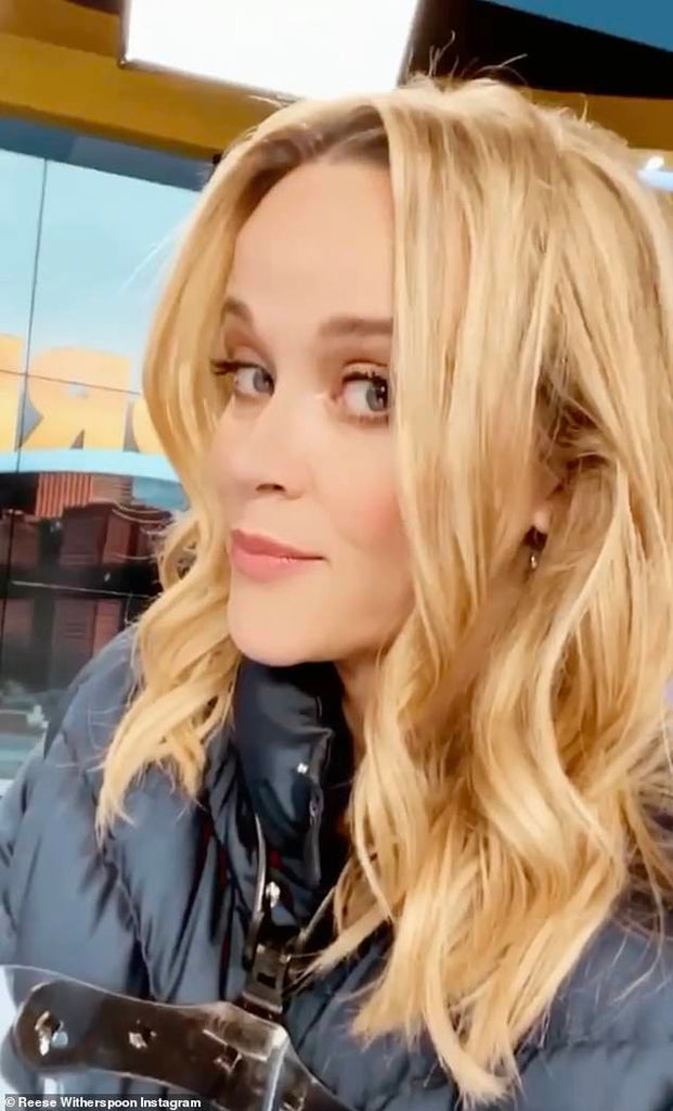 Reese Witherspoon flashes a smile as she announces her return to work on set of The Morning Show